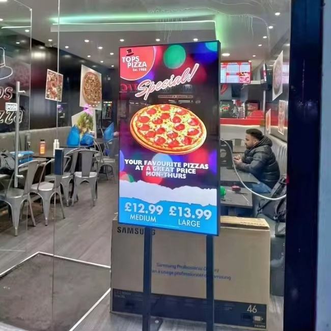 Restaurant digital signage screen showing a pizza promotion